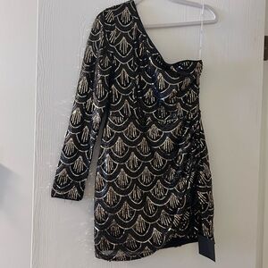 One sleeve sequin dress. New with tags!